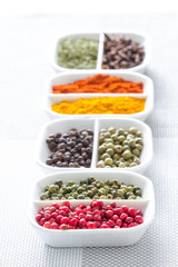 Colorful herbs,spices and aromatic ingredients on modern table.