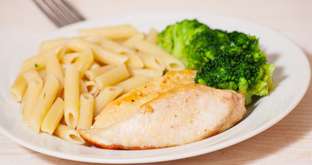 chicken fillet with penne pasta and broccoli