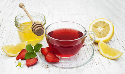 Fruit tea with strawberries, lemon and honey