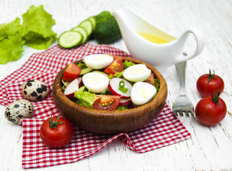 Fototapeta na wymiar Spring salad with eggs, cucumbers and radish
