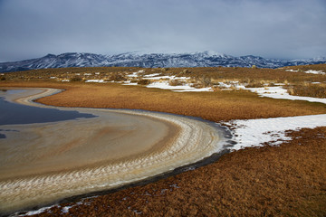 Frozen lake in the grasslands of Torres del Paine National Park in Patagonia, Chile