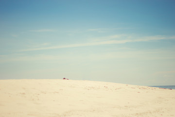 Sand beach and sky. Retro filter