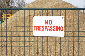 NO TRESPASSING sign at construction site
