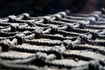 old fishing net over wooden surface