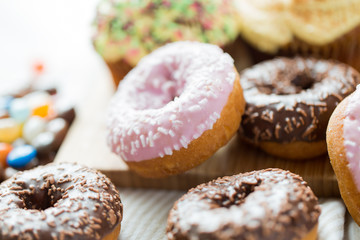 close up of glazed donuts pile on table