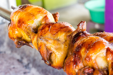 appetizing toasted chicken in charcoal grills
