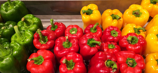 Colorful Red Yellow Green Sweet Bell Peppers in The Market Background Texture