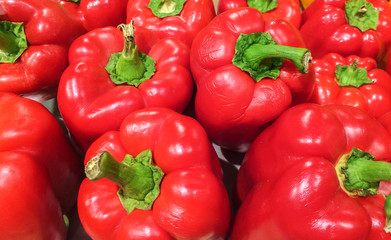 Red Sweet Bell Peppers in The Market Background Texture
