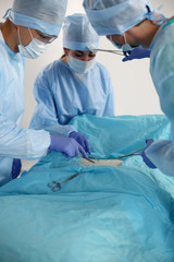 Team surgeon at work in operating room