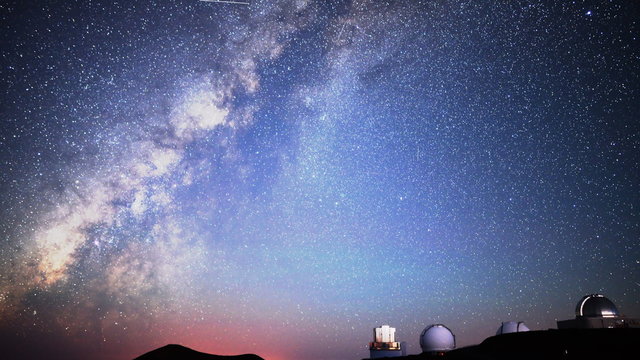 Astrophotography time lapse with tilt up motion of milky way galaxy over Mauna Kea Observatories in Hawaii at dawn