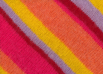 Closeup of colourful knitted striped fabric