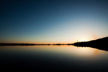 Fototapeta na wymiar Sundown and calm lake