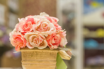 artificial fake flower bouquet on blurred background