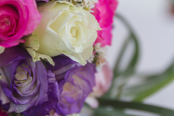 wedding bouquet of white, purple and violet roses