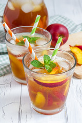 Two glasses of refreshing homemade nectarine iced tea