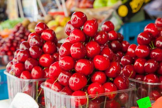 Display of cherries ready to eat at a market.