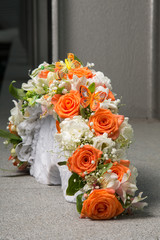 bridal bouquet with orange roses and butterfly