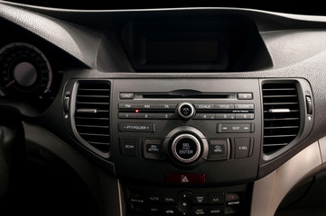 Modern car dashboard. Multimedia control system. Interior detail.