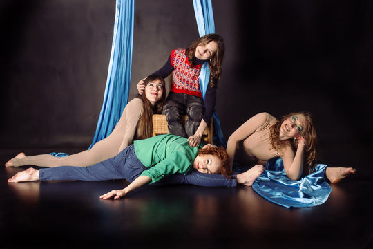 Four aerial gymnasts with silk