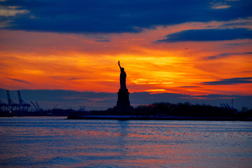 Statue of liberty in new york during sunset