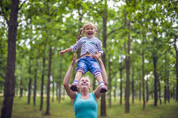 mother and daughter having fun in the park