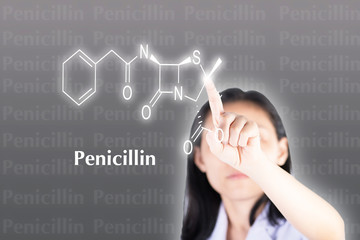 Technician pressing penicillin structure on computer with touch