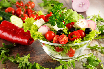Vegetable salad bowl on kitchen table. Balanced diet