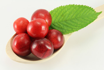 Abstract view cherry in a wooden spoon
