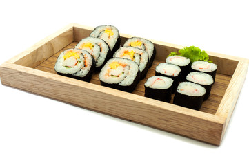 Sushi set in a kitchen board