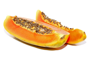Half cut papaya fruits on white background