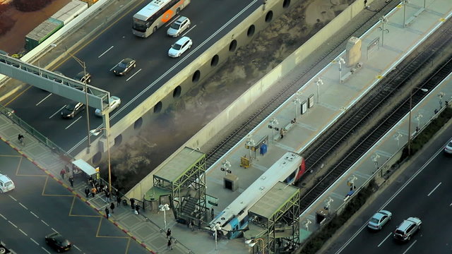 Aerial view of the city Tel Aviv during the afternoon. Train leaving station.