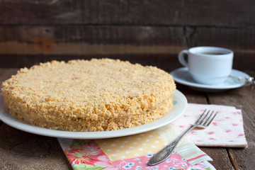 Cake Napoleon of puff pastry with custard cream on a plate