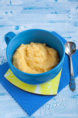 Polenta, the Cornmeal Porridge in a blue bowl