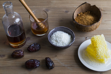 Selection of sweetener ingredients including honey sugar and maple syrup