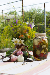 Banks with pickled vegetables - cucumbers, tomatoes, zucchini, and spice