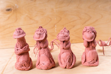 Four Seated Monkeys Handcrafted from Red Clay