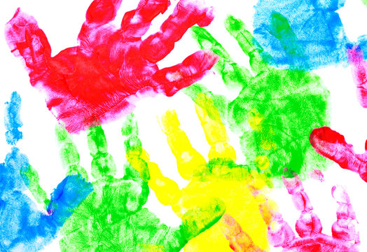 Multicolored painted hand prints on a white background