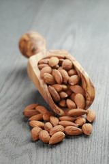 roasted almonds on gray wooden table