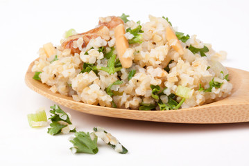 Tabbouleh on a Spoon – Tabbouleh with parsley, onions, and nuts on a spoon.