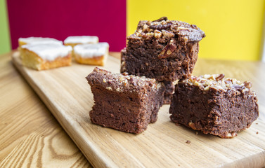 delicious cakes on wooden board
