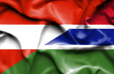 Waving flag of Gambia and Austria