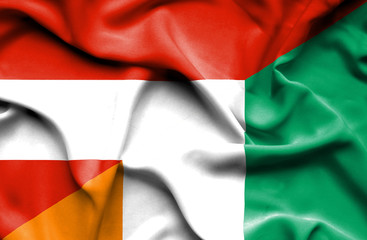 Waving flag of Ivory Coast and Austria