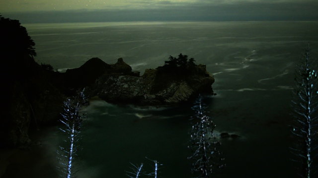  Motion controlled dolly astrophotography time lapse footage with zoom out motion of Mc Way Falls at night in Julia Pfeiffer Burns State Park, Big Sur, California