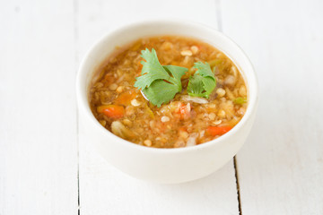 Spicy seafood dipping sauce for seafood on wood background
