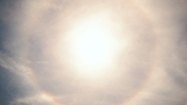  Time lapse footage of rare halo phenomena caught on camera with perfect circular rainbow around the sun