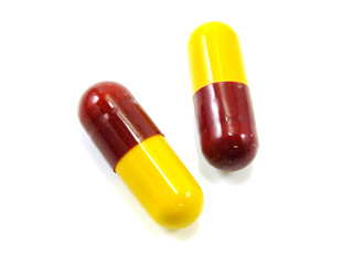 colored capsules closeup on white background