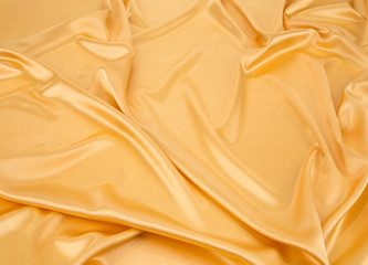 Fototapeta premium Golden silk drapery. 
