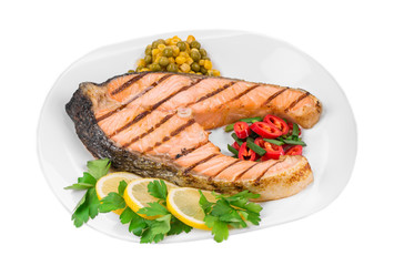 Fried salmon fillet on plate. 