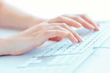 Fotobehang Female hands or woman office worker typing on the keyboard © vladstar