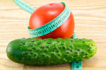 Cucumber and tomato with measuring